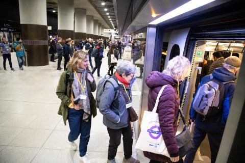 Elizabeth line passengers board train 